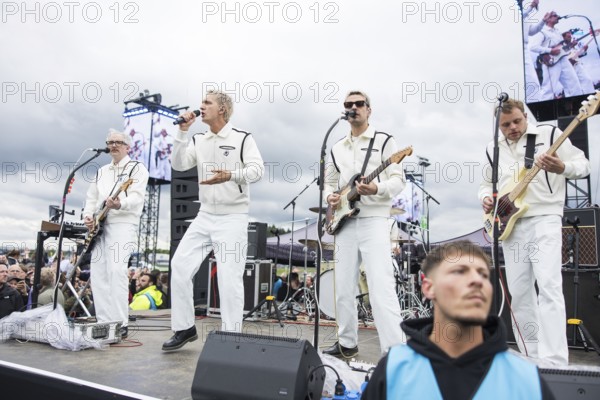 Steffen Israel (guitarist and keyboarder), Felix Brummer (singer), Karl Schumann (guitarist) and Till Brummer (bassist) of Kraftklub at a secret gig of the band at the Rock am Ring Festival on Saturday, Nürburgring race track race track, 07.06.2025