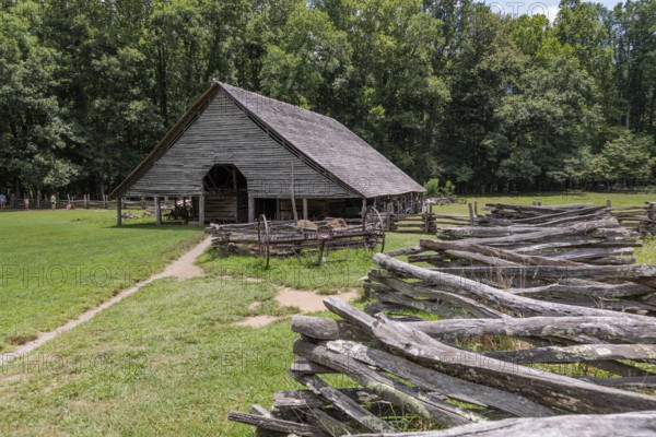 Historic log buildings at the Oconaluftee Visitor Center at Great Smoky Mountains National Park near Cherokee, North Carolina, USA