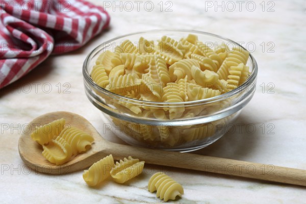 Italian pasta in a glass bowl, Radiatori variety