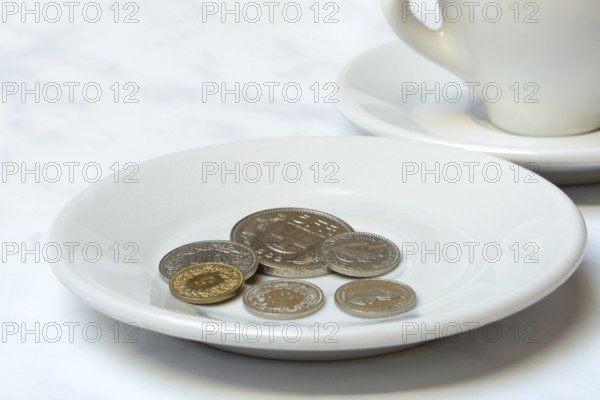 Tip, Swiss coins on plate, Switzerland