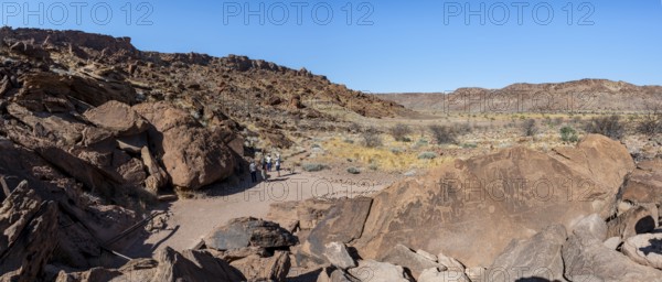 Tourists visiting the rock engravings of Twyfelfontein, Twyfelfontein, Kunene, Namibia