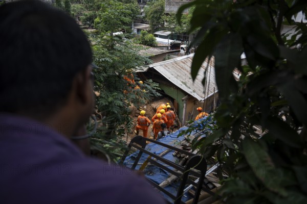 Rescue operations by the National Disaster Response Force (NDRF) and police are in full swing after a major landslide, triggered by a heavy downpour, in Guwahati, India, on June 7, 2025. One person was reported missing in thr landslide and two houses damaged