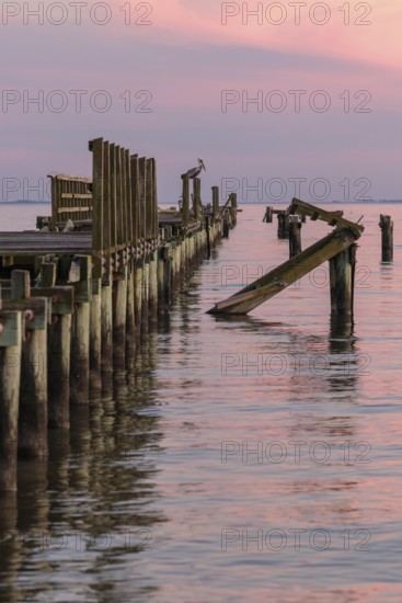 Dilapidated fishing pier damaged from hurricanes in Long Beach, Mississippi, USA
