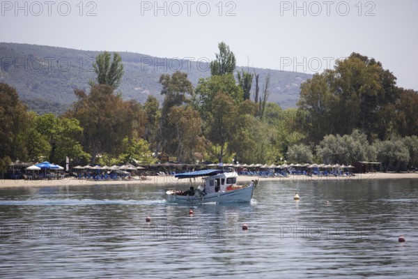Fishing boat in the Pagasitic Gulf, behind the beach of Kala Nera, Pelion or Pelion Peninsula, Magnisia, Thessaly, Greece