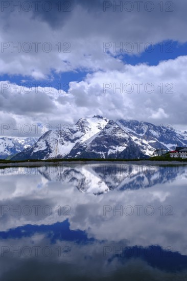 Mountain lake with alpine panorama, snow pond Finkenberg, Penken, Mayrhofen, Zillertal, Tyrol, Austria