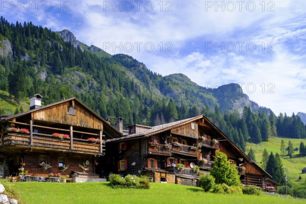 Old farmhouses in the hamlet of Kratten, Sappada, Plodn, Carnic Alps, Julian Friuli, Italy
