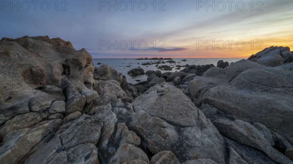Sunset, rocky coast near Porto Pollo, Corsica, France