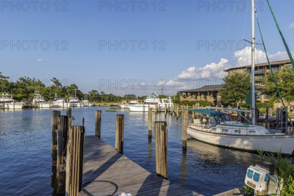 Sailboat and fishing boats in the private marina at the Grand Hotel in Point Clear, Alabama