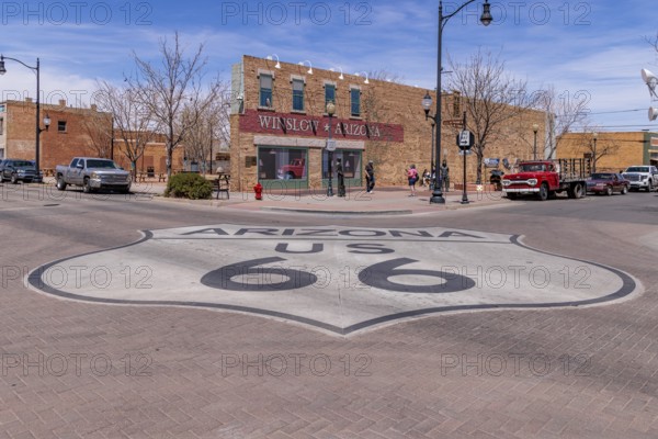 Tourists take photos Standin' on a Corner in Winslow Arizona as sung in the classic Glenn Frey and Jackson Browne song