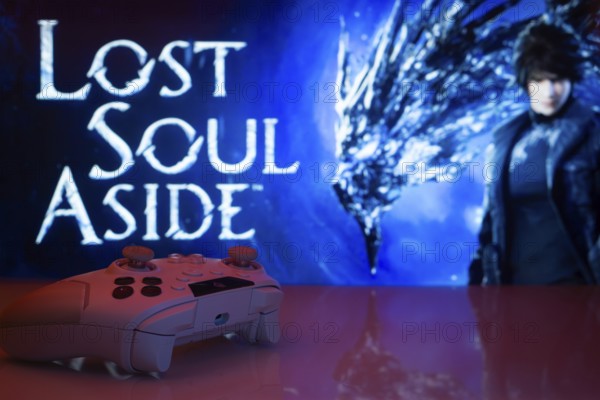 A video game setup featuring a controller and Lost Soul Aside screen with silhouetted figures