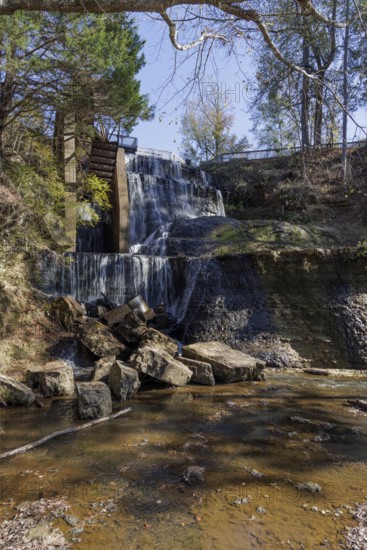 Water diverted from nearby Chunky River to this man-made waterfall to power a grist and cotton mill at Dunn's Falls Park near Enterprise, Mississippi, USA