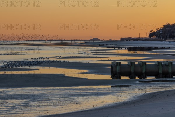 Sunset on the Mississippi Sound along the coastline of Long Beach, Mississippi, USA