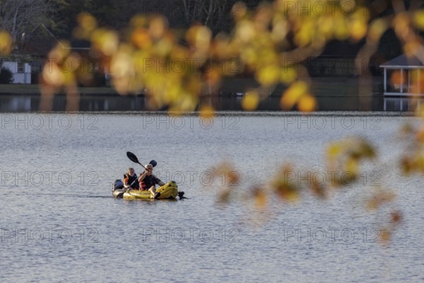 Senior couple paddleing a an inflatable kayak on Archusa Creek Lake at Archusa Creek Water Park near Quitman, Mississippi