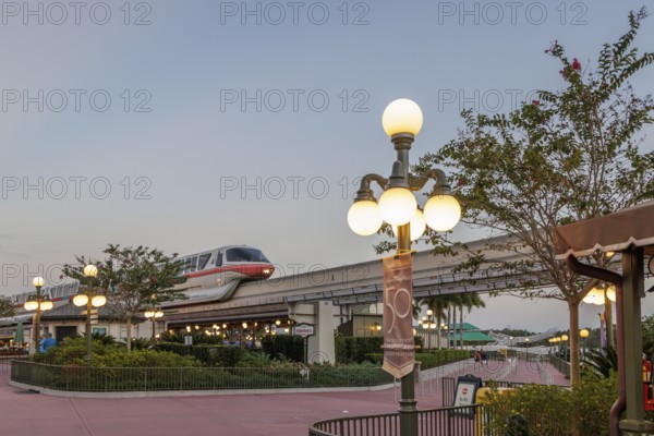 Monorail carries passengers toward the entrance to the Magic Kingdom at Walt Disney World in Orlando, Florida, USA