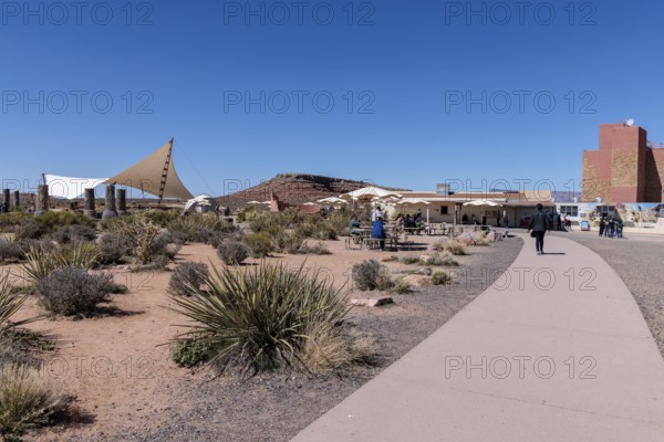 Umbrella shaded tables and a large awning provide visitors shade from the desert sun at Eagle Point in Grand Canyon West near Peach Springs, Arizona
