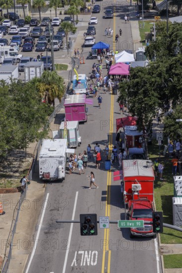 Guests purchasing food from food trucks at the Biloxi Seafood Festival in Biloxi, Mississippi