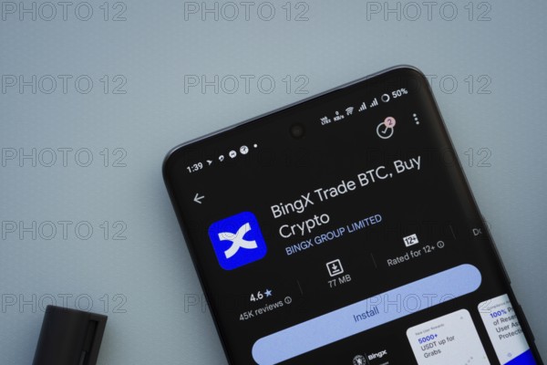 On a blue surface, a smartphone displays the BingX app within the Google Play Store