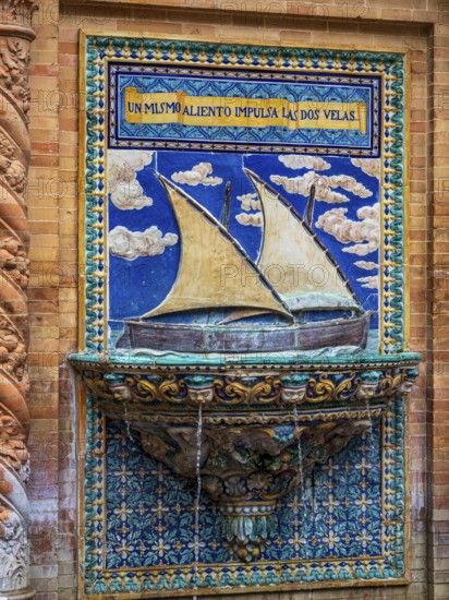 Botanic garden at the plaza espana, fountain with decoration showing sailing ship, Seville, Andalusia, Spain