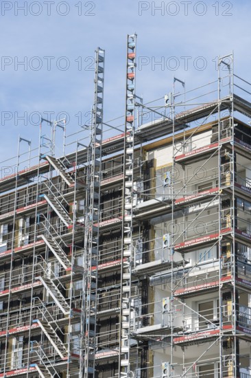 Symbolic image, residential construction, new building, corner building with extensive scaffolding, construction industry, trade, Baden-Württemberg, Germany