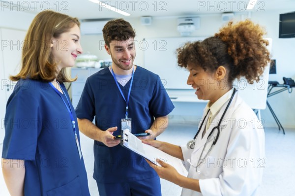 Doctors and nurses collaborating, analyzing medical records and discussing patient treatment in a hospital setting