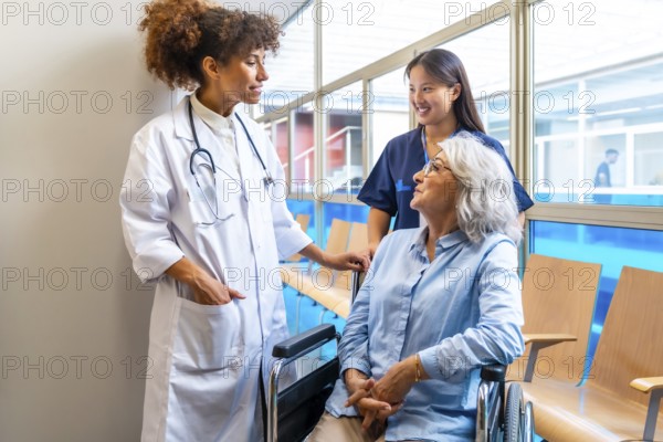 Medical professionals providing care and support to an elderly patient in a wheelchair, highlighting the importance of healthcare for senior citizens