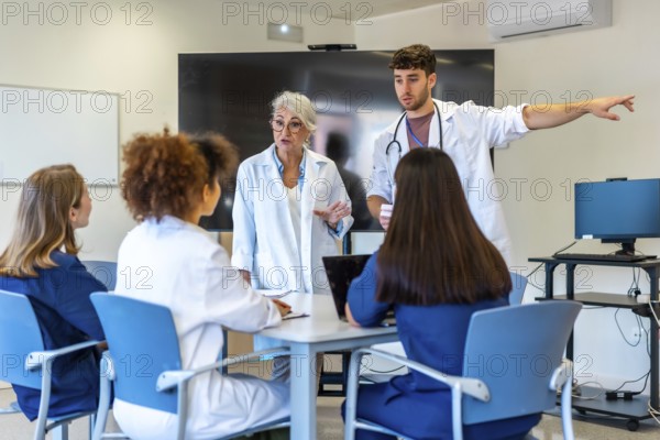 Doctors and nurses having a meeting in a hospital conference room, discussing patient cases and treatment strategies