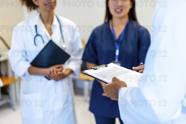 Doctors and nurses are meeting together, sharing expertise and collaborating on patient care, enhancing healthcare quality