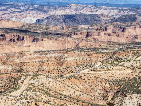 Gravel roads in the desert, 4x4 car, colorful canyons and gorges, Gorafe Desert, UNESCO Granada Geopark, Granada province, Andalusia, Spain