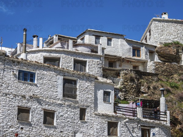 Whitewashed facade of a tradtional house, village Trevelez, one of the whitewashed villages on the slopes of the Sierra Nevada, Andalusia, Spain
