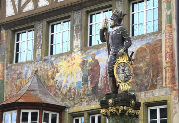 Soldier figure on the market fountain, house facade with facade painting in the old town, Stein am Rhein, Canton Schaffhausen, Switzerland