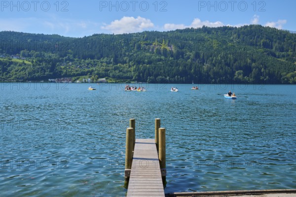 Lake shore, wooden jetty, rowing boats, summer, Lake Millstatt, Millstatt, Carinthia, Austria