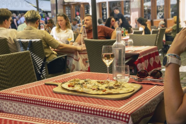 Alsatian tarte flambée in a street café in the historic centre of Strasbourg
