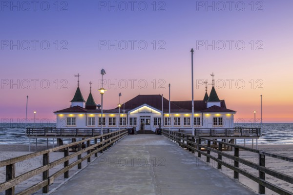 Restaurant on Ahlbeck Pier/ Seebrücke Ahlbeck in the Baltic Sea at sunrise on Usedom island, Mecklenburg-Vorpommern, oldest pier in Germany
