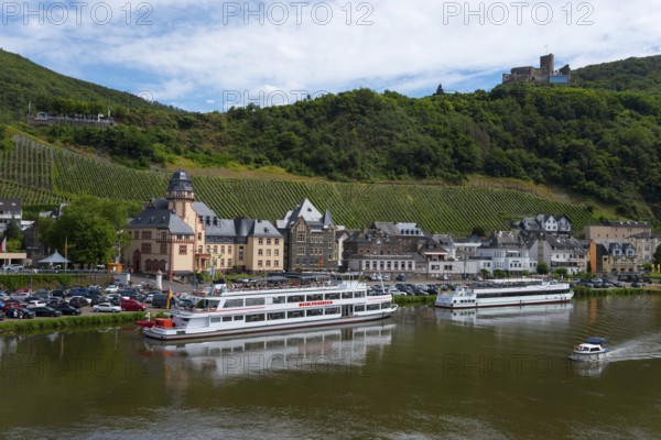 River landscape with anchored ships on the banks, surrounded by vineyards and historic buildings, Bernkastel district, Bernkastel-Kues, Moselle, Rhineland-Palatinate, Germany