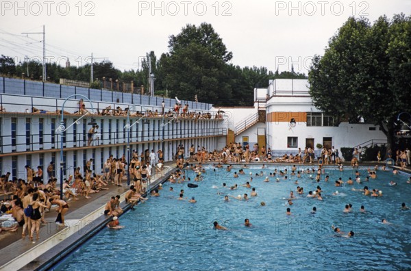 Crowded outdoor swimming pool, Madrid, Spain 1959