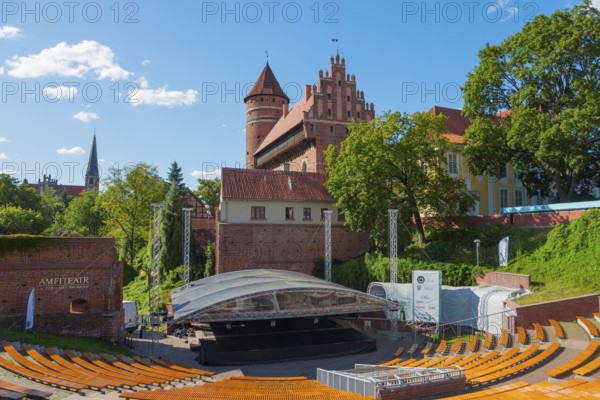 Medieval castle with open-air amphitheatre and surrounding trees, castle and amphitheatre, Olsztyn, Olsztyn, Warmia-Masuria, Poland