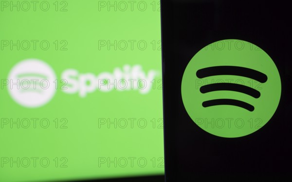 Spotify logo is seen on a smartphone