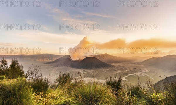Sunrise, smoking volcano, Gunung Bromo, Mount Batok, Mount Kursi, Mount Semeru, Bromo Tengger Semeru National Park, Java, Indonesia