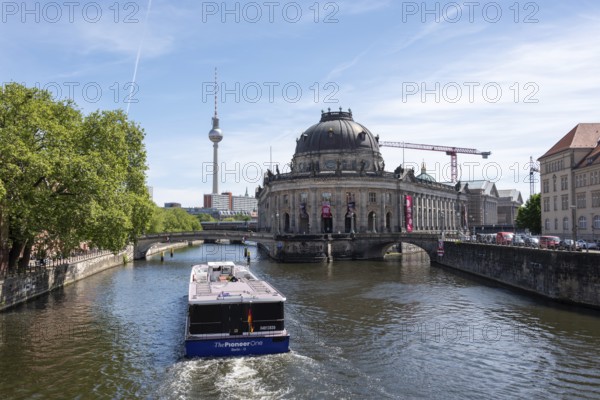 Museum Island, Bodemuseum, behind it the television tower, in front the Spree with the ship The Pioneer One, Berlin, Germany