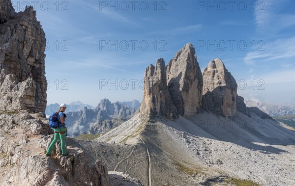 Hiker on the via ferrata to Patternkofel, Northern walls of the Three Peaks, Sesto Dolomites, South Tyrol, Trentino-South Tyrol, Alto-Adige, Italy