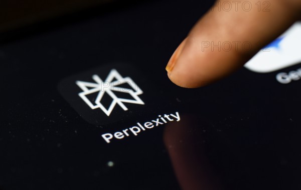 In this photo Illustration a person browsing taps perplexity app icon on a tablet device on 24 May 2025 in New Delhi, India