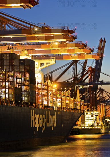 Container ships at the Eurogate container terminal in the evening with an atmospheric sunset, harbour, Hamburg, Germany