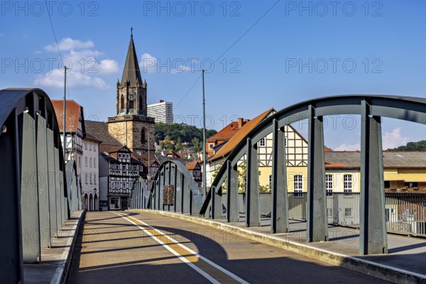 Modern bridge with a view of the church and half-timbered houses, blue sky, The town of Rotenburg an der Fulda