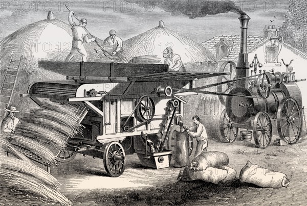A steam-driven threshing machine, 19th century