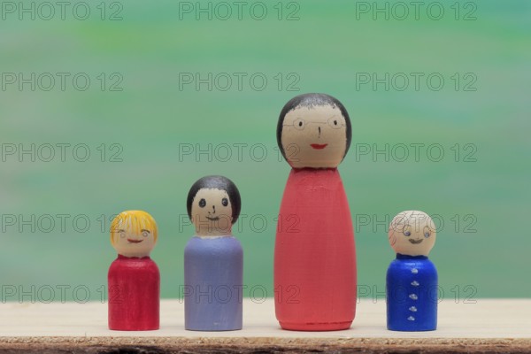Various large and small colourful wooden cones in front of a painted background, North Rhine-Westphalia, Germany