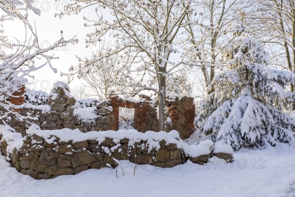 Snow on the remains of a wall in Scharfenberg, Klipphausen, Saxony, Germany