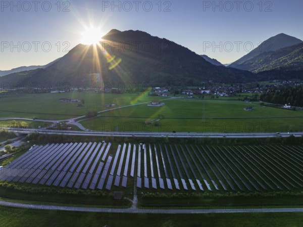Aerial view, solar system, photovoltaics, morning light, backlight, mountains, sunny, spring, near Eschenlohe, Alpine foothills, Bavaria, Germany