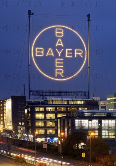 Bayer cross in the blue hour on the premises of Bayer AG, Leverkusen, Bergisches Land, North Rhine-Westphalia, Germany