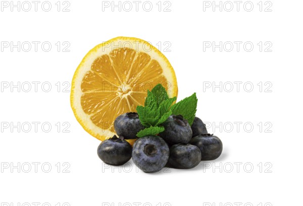 Lemon with blueberries and mint, on a white background, isolate, food concept