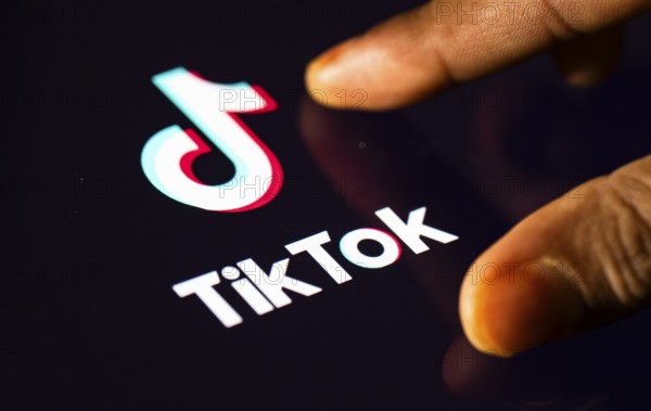 In this photo Illustration a person browsing taps Tiktok Application on a tablet device on 24 May 2025 in New Delhi, India